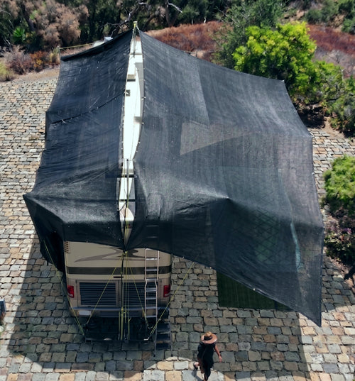 Hovershade™ Portable Modular RV CarPort  frame and shade fabric secured to roof of 40-foot RV — rear angle view full closed shade with shade sides pulled out 1400 sqft coverage