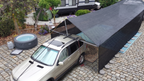 Hovershade covering a Suv and trailer as a breezway