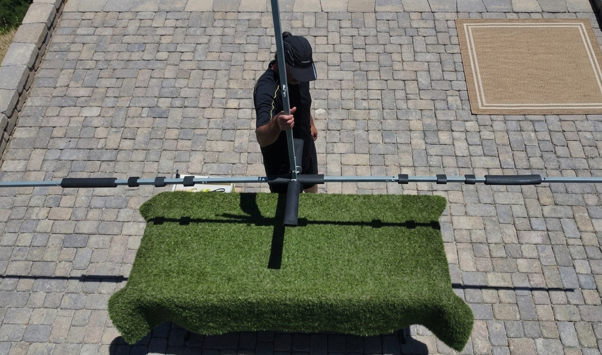 Person lifting up the shade frame canopy structure with one arm at 32 lbs