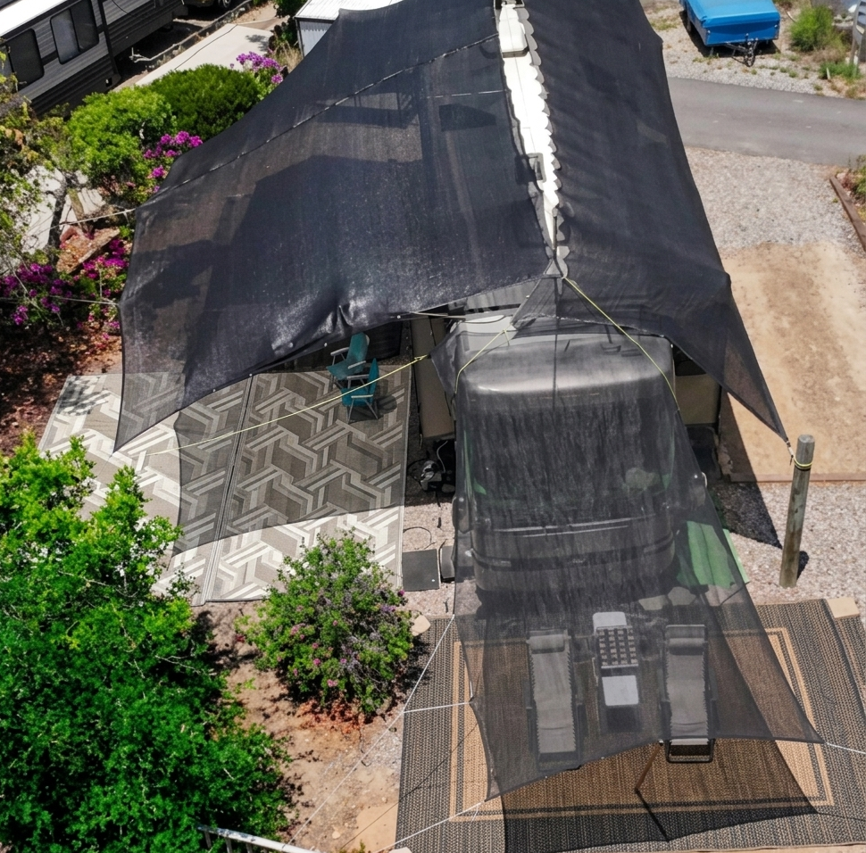 Shade and shade canopy frame over A 42 foot RV in an RV park