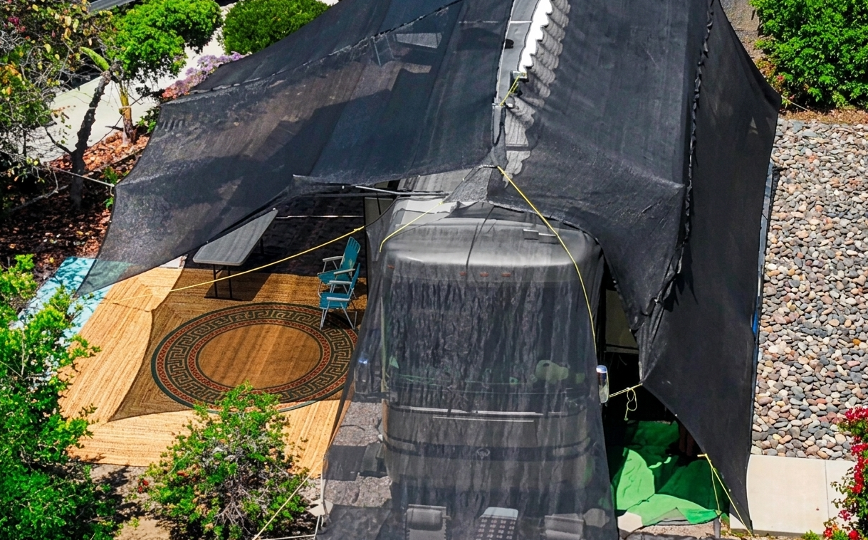 MASSIVE SHADE completely covering a 40 foot Rv area with shade roon underneath