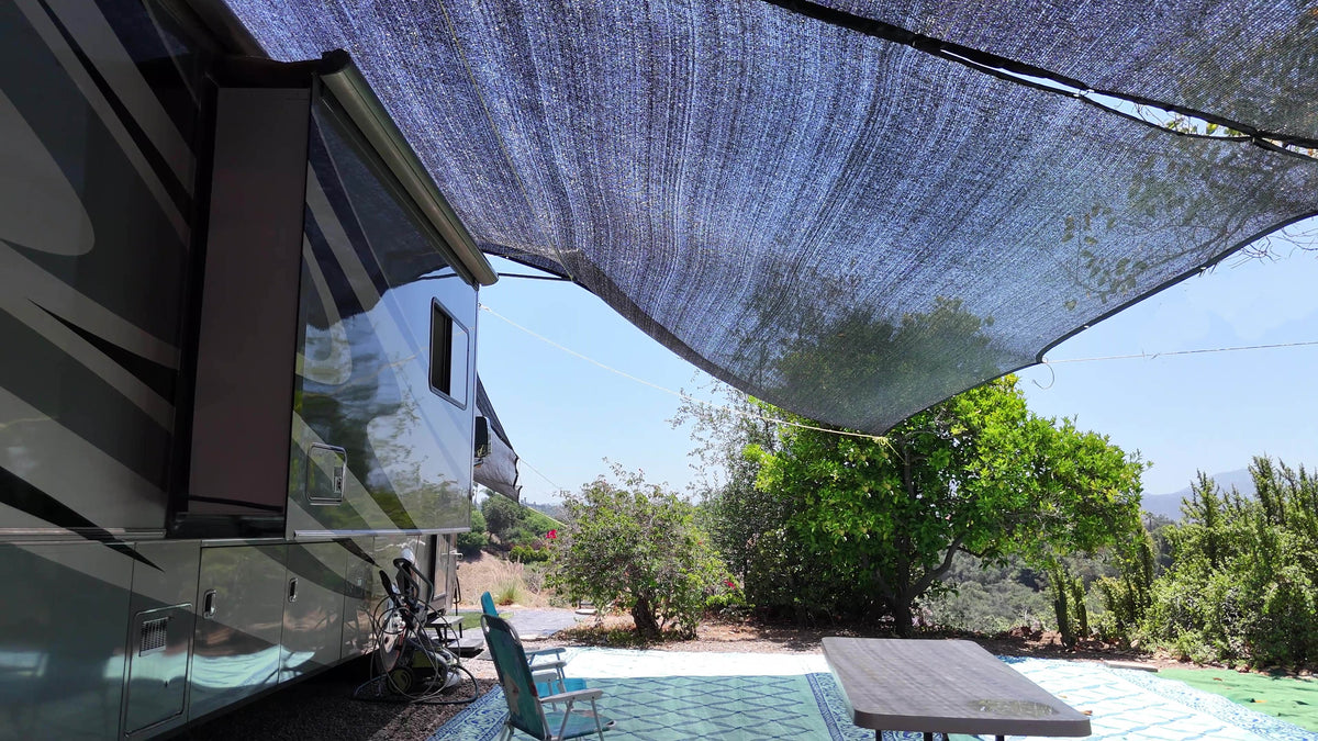 Showing an example of a massive shade canopy over a 40 foot RV and how the shade looks on the ground