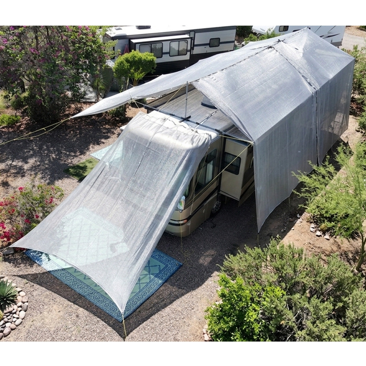 Hovershade RV covered with a large white canopy in an outdoor setting