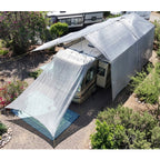 Hovershade RV covered with a large white canopy in an outdoor setting