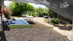 Showing an example of a massive shade canopy over a 40 foot RV and how the shade looks on the ground
