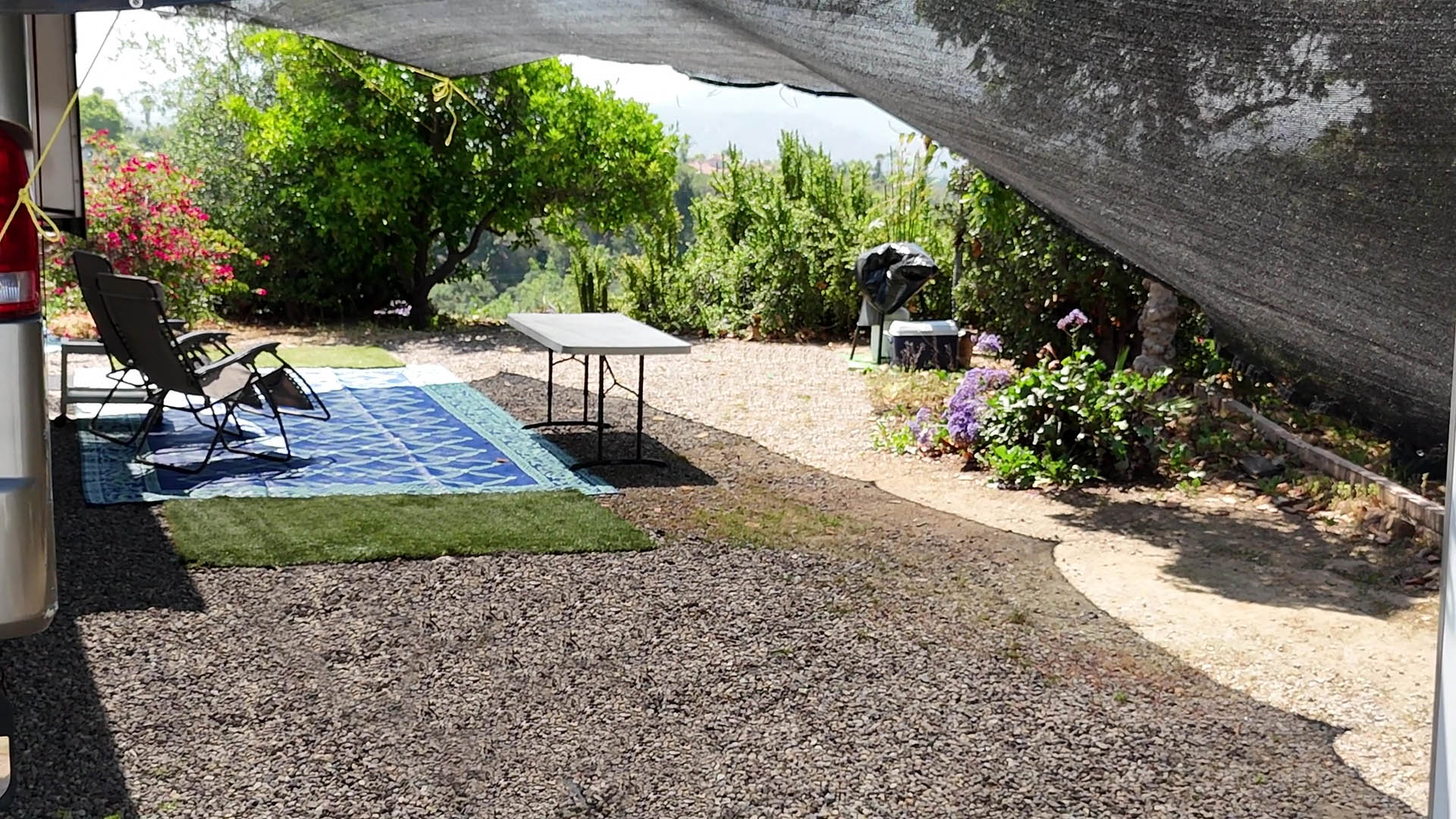 Showing an example of a massive shade canopy over a 40 foot RV and how the shade looks on the ground